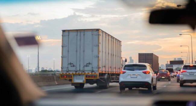 Car and trucks in Traffic jam on highway in rush hour